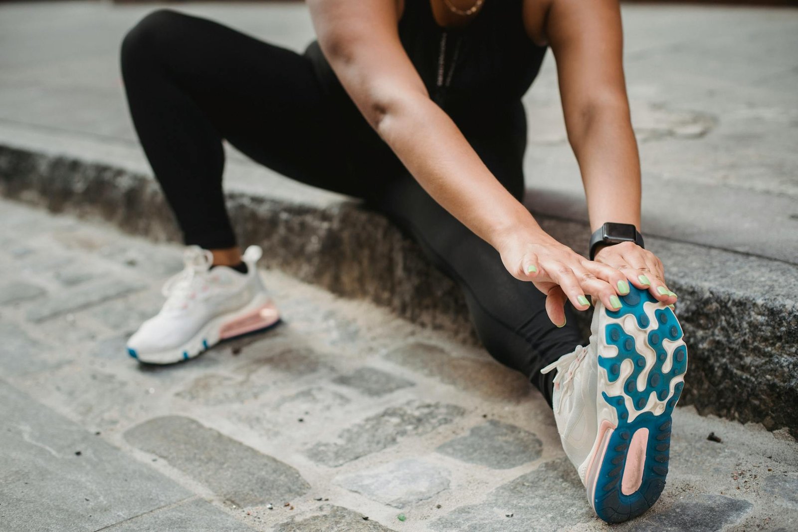 https://www.pexels.com/photo/a-man-stretching-on-a-sidewalk-5036892/